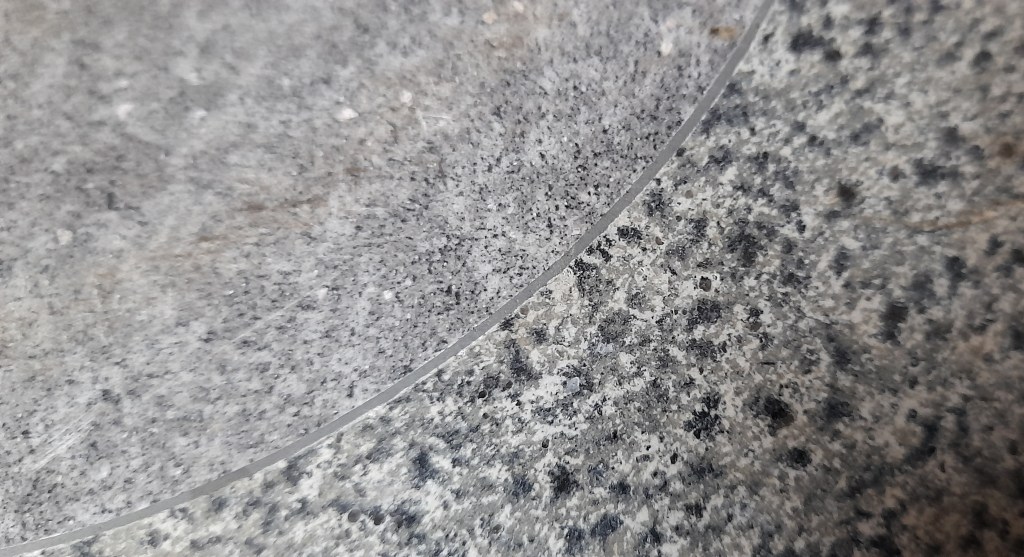 Close up photo of the two types of rock within the curling stone.